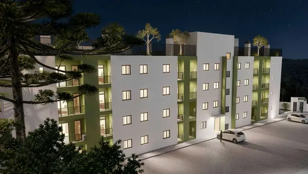 Fachada do Residencial Patmos à noite, com as sacadas iluminadas (perspectiva artística)